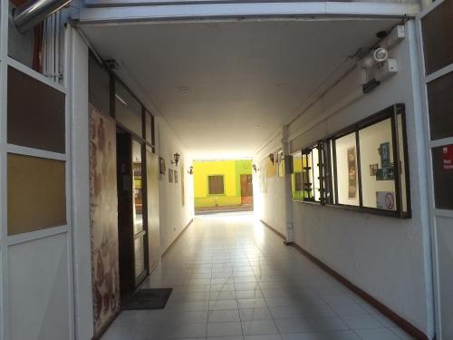 an empty hallway of a building with a hallway at Hotel Diaguitas Illapel in Illapel