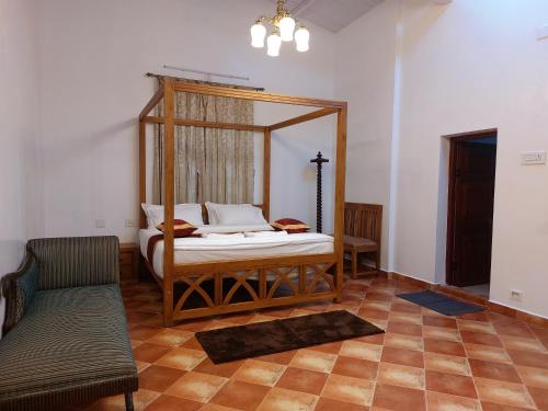 Postel nebo postele na pokoji v ubytování Jennings Abode Doddabetta