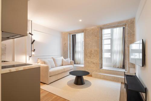 a living room with a couch and a table at Marina 30 in A Coruña
