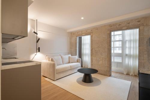 a living room with a couch and a table at Marina 30 in A Coruña