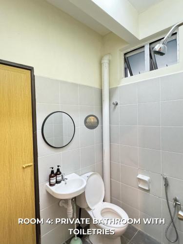 a bathroom with a toilet and a sink at Senja Stay Homestay Kulim in Kulim