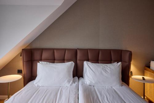 Postel nebo postele na pokoji v ubytování Hotel Akureyri