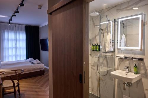 Postel nebo postele na pokoji v ubytování Hotel Akureyri