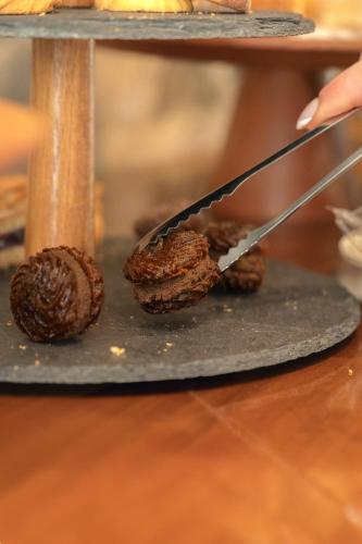 a person cutting a cookie with a knife at Albergo Sappia in Arma di Taggia