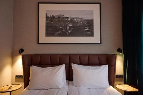 Postel nebo postele na pokoji v ubytování Hotel Akureyri