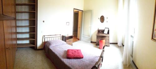 a living room with a bed and a stair case at Stop and Go in Olgiate Comasco