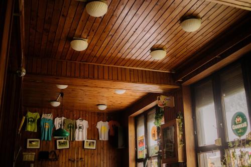 a room with shirts hanging on a wall at Chata Žiar in Rajecká Lesná