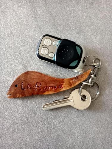a key chain with a cell phone on top at La Romea in Altopascio