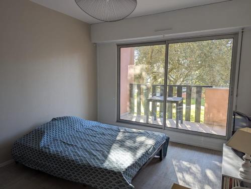 En eller flere senge i et værelse på Studio sous les pins - 400m de la plage dePornichet