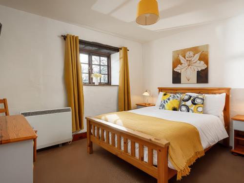 Postel nebo postele na pokoji v ubytování Ash Cottage