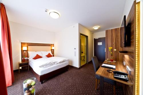 Postel nebo postele na pokoji v ubytování Wohlfühl-Hotel Neu Heidelberg
