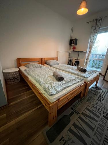 two large wooden beds in a room at Patent, your home in Badacsony in Badacsonytomaj