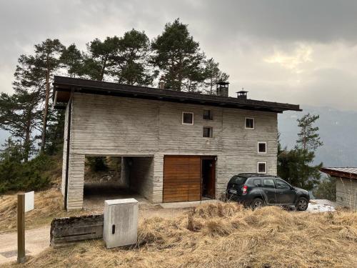 a car parked in front of a house at Chalet con vista - Olimpiadi 2026 in Vodo Cadore