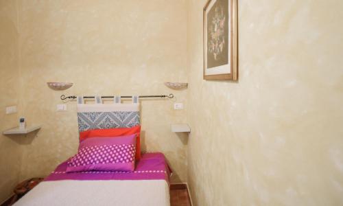 Кровать или кровати в номере Giardino dei Limoni Rooms
