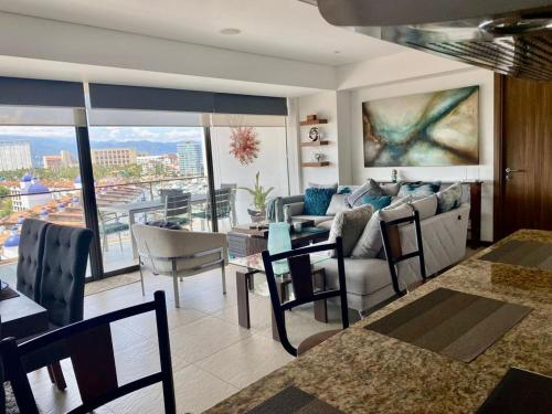 a living room with a couch and a table at Nima Bay, Marina Vallarta in Puerto Vallarta