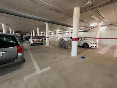 a parking garage with two cars parked in it at Charming duplex in Hacienda del Álamo in Fuente Alamo