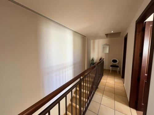 a hallway with a staircase in a house at Charming duplex in Hacienda del Álamo in Fuente Alamo