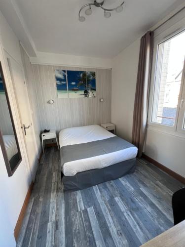 Katil atau katil-katil dalam bilik di Hotel De l'Univers