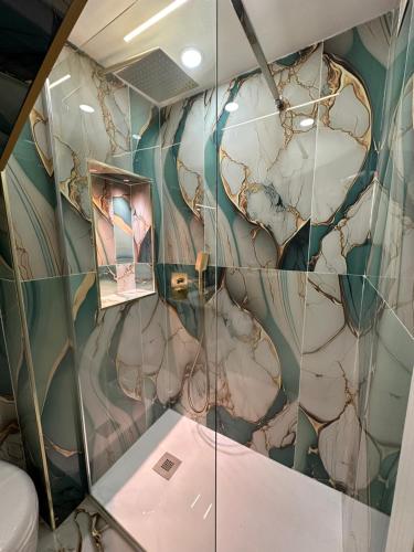 a room with a wall covered in glass at Suite Sanità in Naples