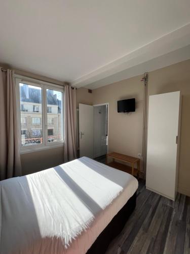 Katil atau katil-katil dalam bilik di Hotel De l'Univers