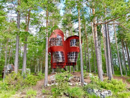 a tree house in the middle of the forest at Haven Islands incredible treehouse on private island in Torrflonäs