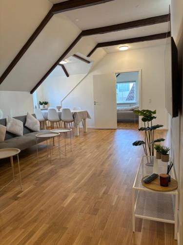 an open living room with a couch and tables at Central Living Billund - By Viktorija #1 VIEW in Billund
