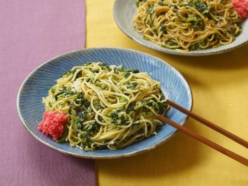 two plates of pasta and broccoli on a table at Vessel Hotel Higashi Hiroshima in Higashihiroshima