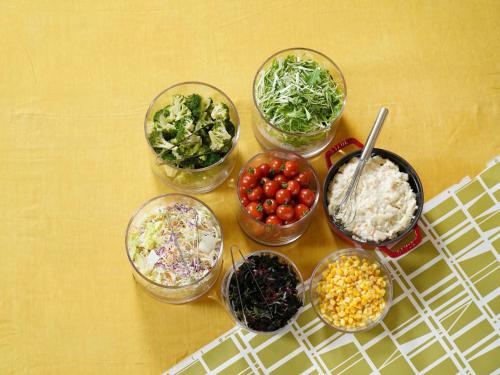 a group of bowls of food on a table at Vessel Hotel Higashi Hiroshima in Higashihiroshima