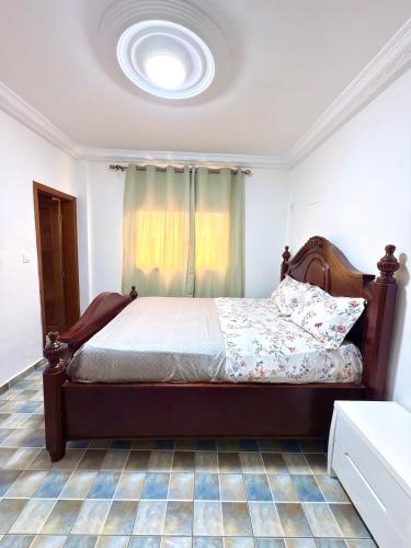 a bedroom with a bed in a room at Hope guests home in Douala