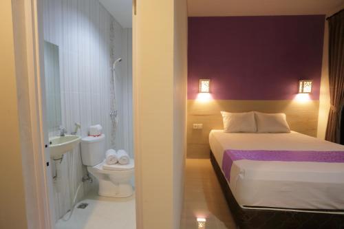 Ένα ή περισσότερα κρεβάτια σε δωμάτιο στο Bali Dream Costel