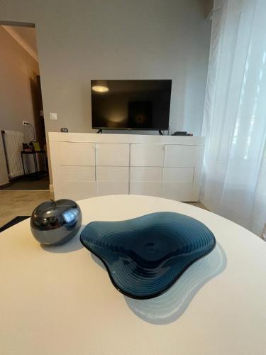a blue hat sitting on top of a table at Ideal studio near Monaco in Roquebrune-Cap-Martin