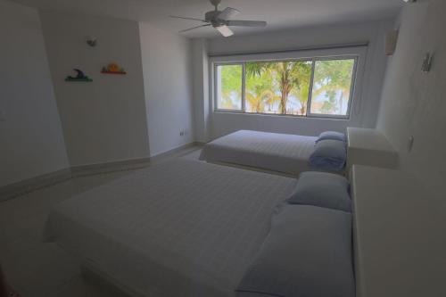 Postel nebo postele na pokoji v ubytování Cabana Mangle Playa Privada
