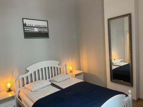 Posteľ alebo postele v izbe v ubytovaní Sienkiewicza Loft1