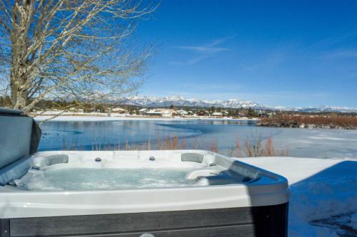 a bath tub sitting in front of a body of water at 156 Teal Circle in Pagosa Springs