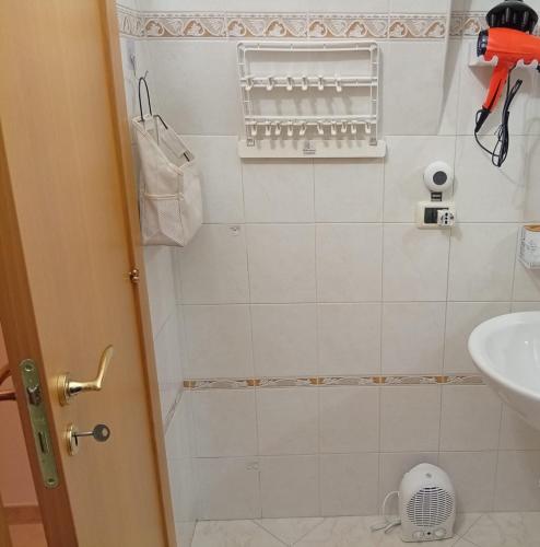 a bathroom with a sink and a shower at CV MiRa house in Putignano