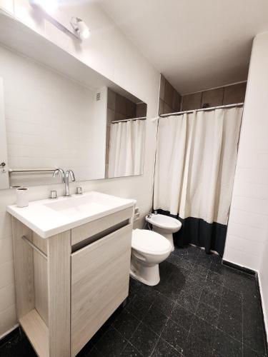 a bathroom with a sink and a toilet in it at Dpto Ituzaingo 1270 - 2 dormitorios in Cordoba