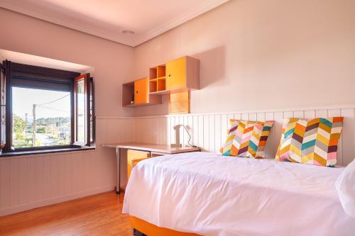 Ένα ή περισσότερα κρεβάτια σε δωμάτιο στο Amplio y soleado apartamento en Escalante