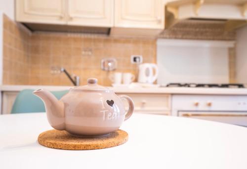 a tea pot sitting on a counter in a kitchen at Villa Antonella Wellness & Jacuzzi in Ciampino
