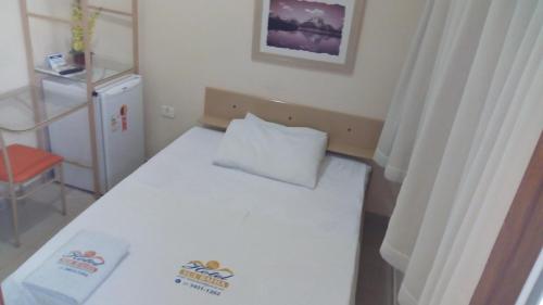Ένα ή περισσότερα κρεβάτια σε δωμάτιο στο Hotel sul bahia