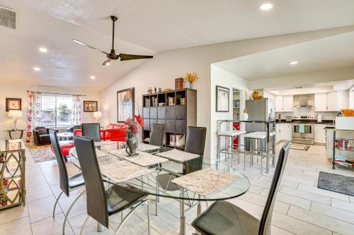 a dining room and kitchen with a glass table and chairs at Families with Pets Welcome! Poolside Gem in Phoenix in Phoenix