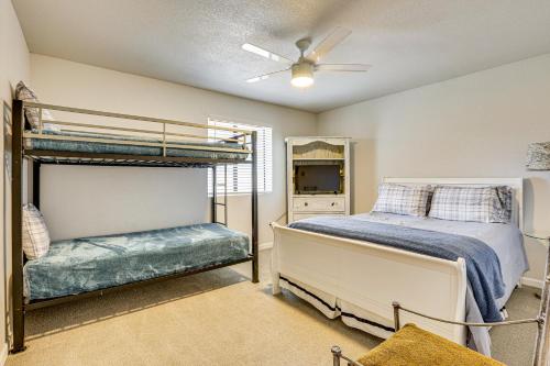 a bedroom with a bunk bed and a tv at Families with Pets Welcome! Poolside Gem in Phoenix in Phoenix