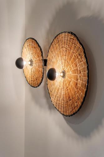 two wicker baskets hanging on a wall at Casa Myrtēssa in Myrtos