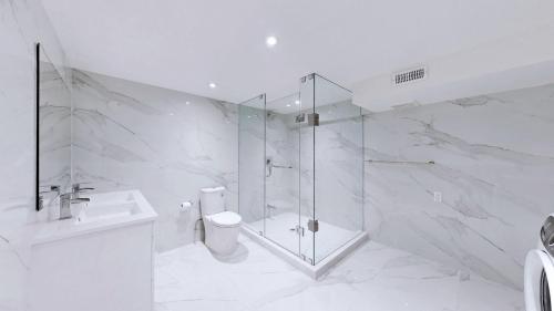 a bathroom with a shower and a toilet and a sink at Comfortable Room in Toronto next to Yorkdale mall in Toronto