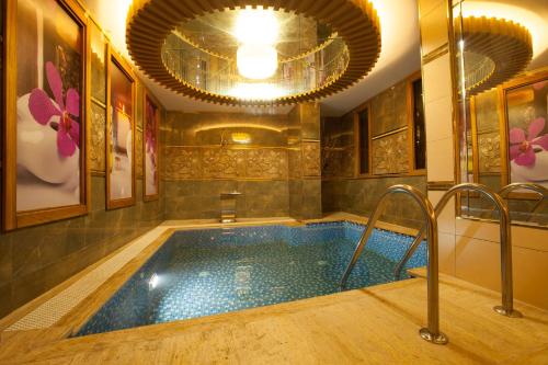 a jacuzzi tub in the middle of a room at Beethoven Hotel - Special Category in Istanbul