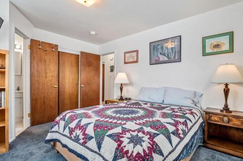 a bedroom with a bed and a wooden cabinet at Rocky Mountain Getaway For Budget Travelers in Leadville