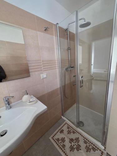 a bathroom with a shower and a sink at Principe Umberto in Parabita