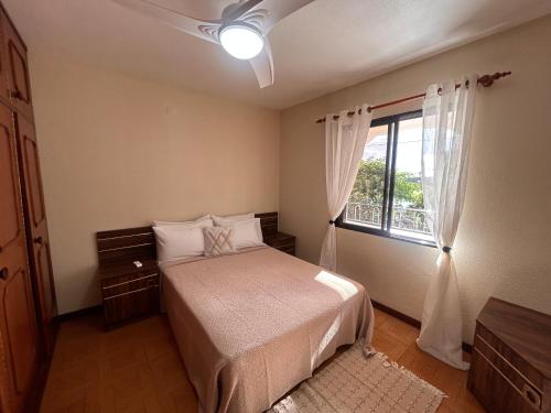 Ένα ή περισσότερα κρεβάτια σε δωμάτιο στο A Casa da Minha Mãe