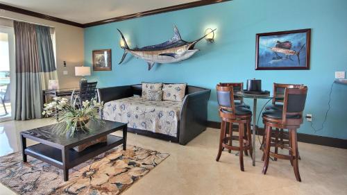 a living room with a couch and a table at 131 Mariners Club in Key Largo