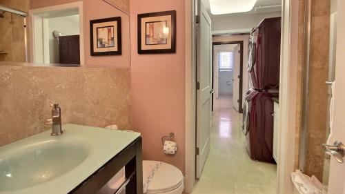 a bathroom with a sink and a toilet at 131 Mariners Club in Key Largo