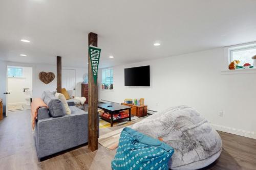 a living room with a couch and a table at Marble Farm in Waitsfield